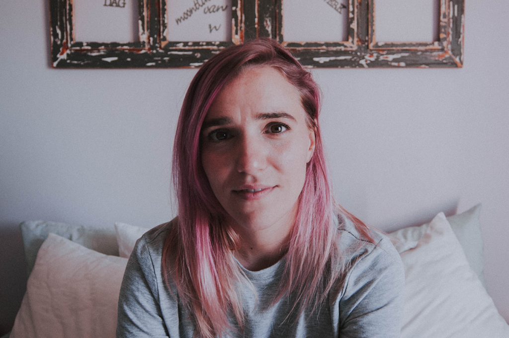 Portrait of a girl with purple hair.