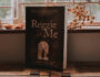 Front cover of Reggie and Me by James Hendry on kitchen counter.